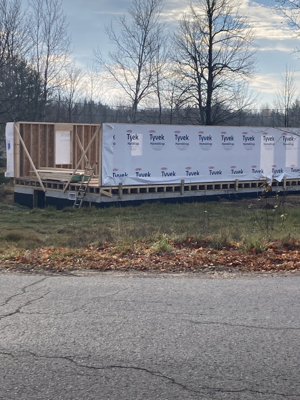 Wall framing with house wrap on a new home under construction, Hannahville Indian Community